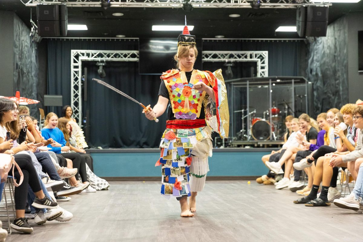 Montgomery Phelps (11) struts down the runway as a Spanish and Mongolian inspired warrior