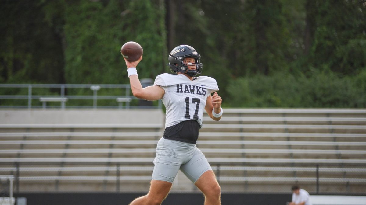 During practice, junior Colt Yancey looks downfield for his receiver.