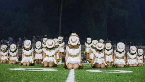 With heads lowered, the Showstoppers prepare to perform their dance to "Hey Ya!"