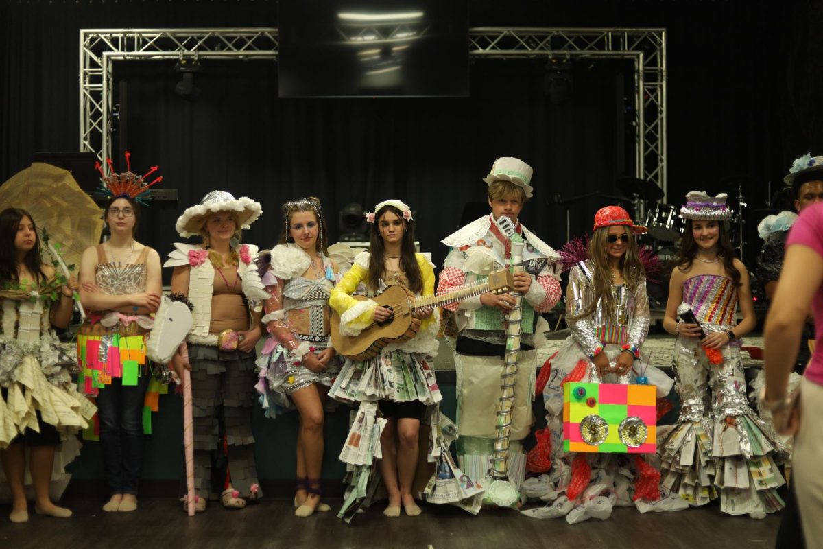 After showcasing their art, Best Day Ever participants pose wearing their outfits.