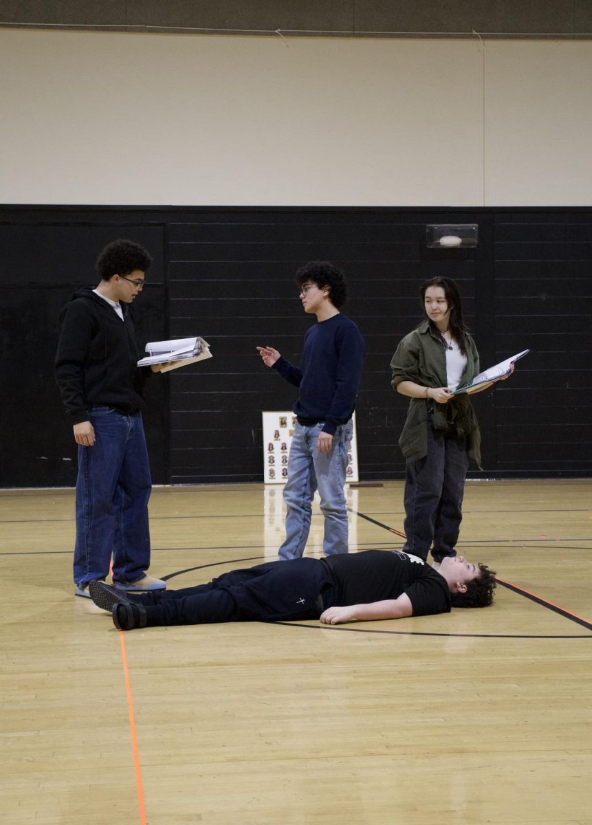 Walking through their scene, sophomores Parker Hall, [left] Cloud Keys, [middle] Lucy Brown, [right] and Braden Frazier [bottom] rehearse after school.