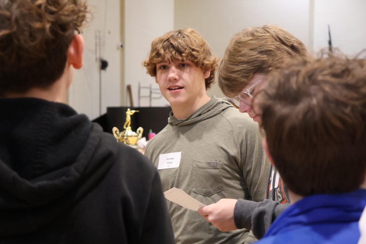 Current freshman Kamden Kyles talks to his group while touring the high school last year. 